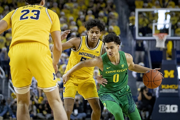 Brandon Johns Jr. (23) and Eli Brooks (55)