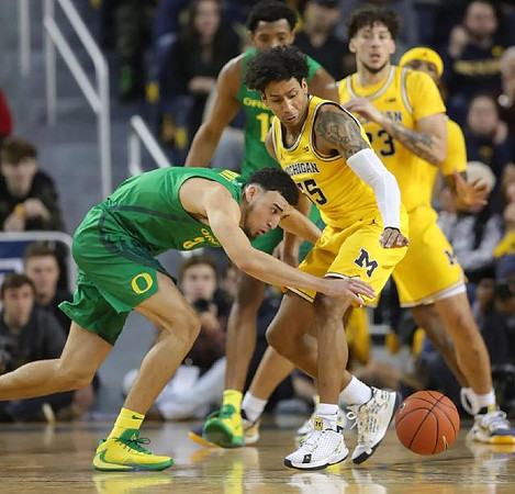 Eli Brooks (55) and Brandon Johns Jr. (23)