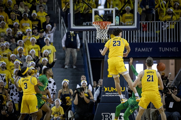 Zavier Simpson (3), Brandon Johns Jr. (23), and Franz Wagner (21)