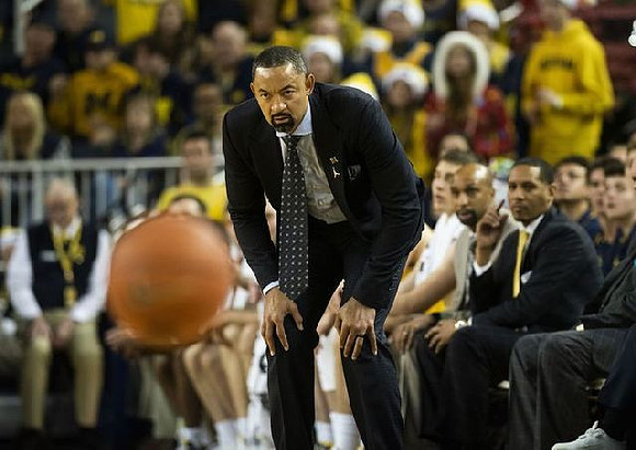 Juwan Howard, Saddi Washington, and Howard Eisley