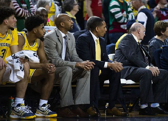 Brandon Johns Jr. (23), David DeJulius (0), Saddi Washington, Howard Eisley, and Phil Martelli