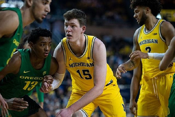 Jon Teske (15) and Isaiah Livers (2)