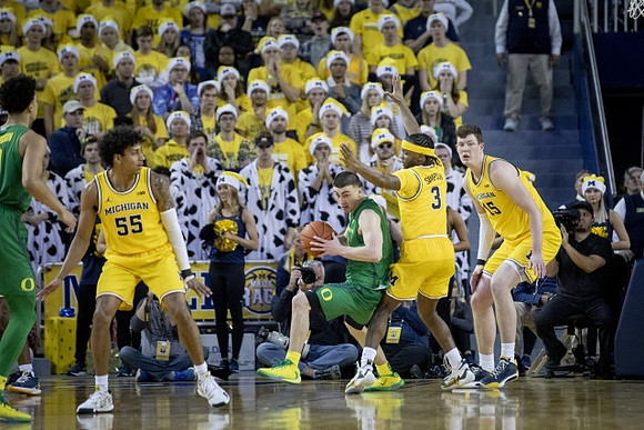 Eli Brooks (55), Zavier Simpson (3), and Jon Teske (15)