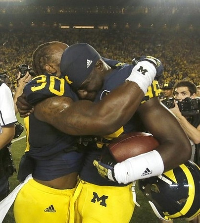 Thomas Gordon (30) and Devin Gardner (98)