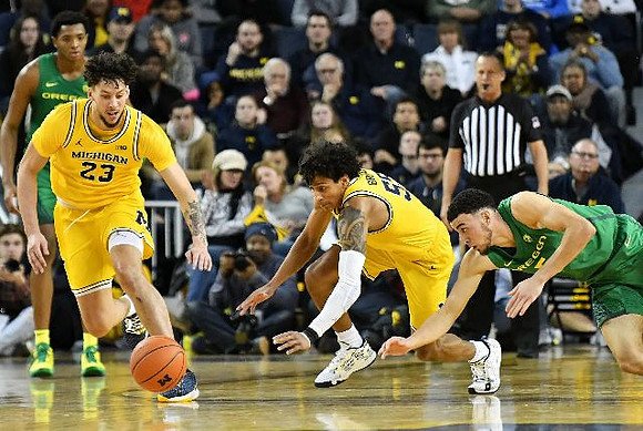 Brandon Johns Jr. (23) and Eli Brooks (55)