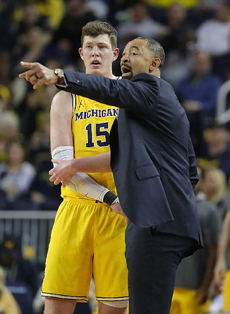Jon Teske (15) and Juwan Howard