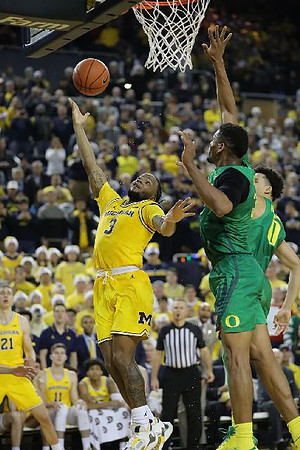 Franz Wagner (21) and Zavier Simpson (3)