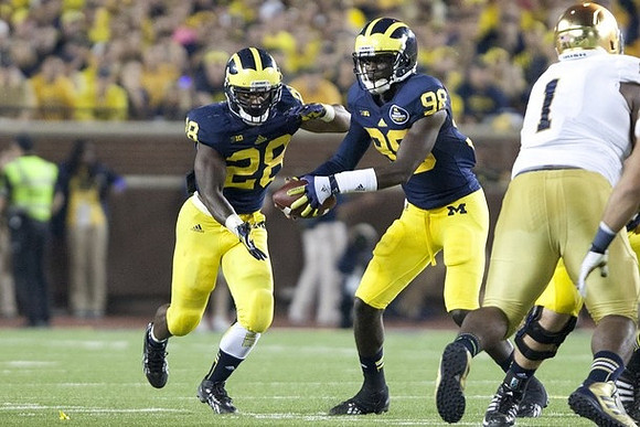 Fitzgerald Toussaint (28) and Devin Gardner (98)