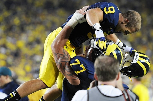Drew Dileo (9) and Taylor Lewan (77)
