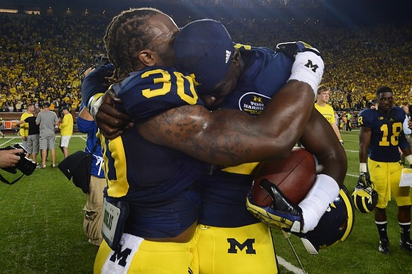 Thomas Gordon (30) and Devin Gardner (98)
