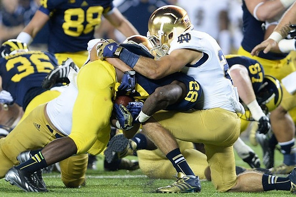 Joe Kerridge (36), Jake Butt (88), Fitzgerald Toussaint (28), and Devin Funchess (87)