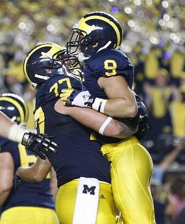 Taylor Lewan (77) and Drew Dileo (9)