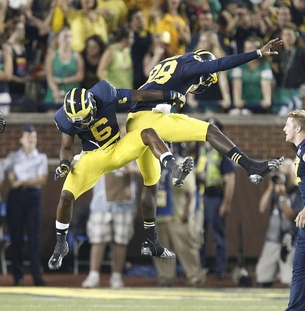 Raymon Taylor (6) and Devin Gardner (98)