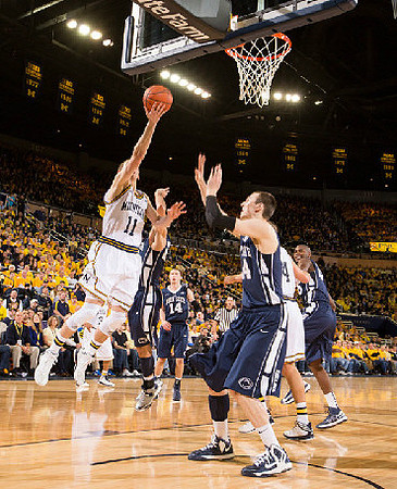 Nik Stauskas (11), Trey Burke (3), and Mitch McGary (4)