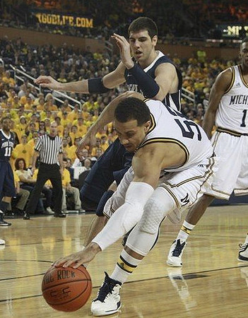Jordan Morgan (52) and Glenn Robinson III (1)