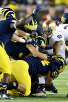 Jareth Glanda (54) and Michigan Team