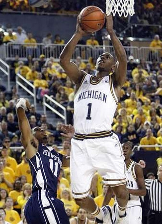 Glenn Robinson III (1) and Caris LeVert (23)