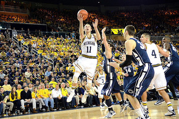 Nik Stauskas (11), Trey Burke (3), and Mitch McGary (4)
