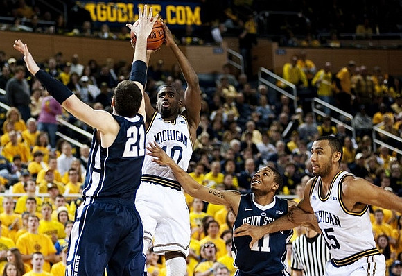 Tim Hardaway Jr. (10) and Jon Horford (15)