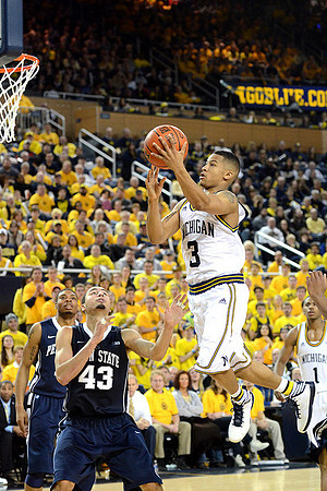 Trey Burke (3) and Glenn Robinson III (1)