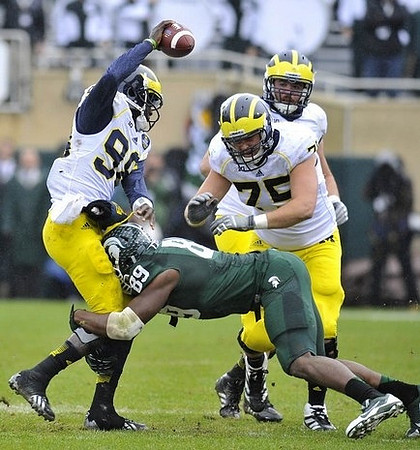 Devin Gardner (98) and Michael Schofield (75)