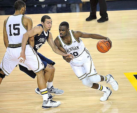 Jon Horford (15) and Tim Hardaway Jr. (10)