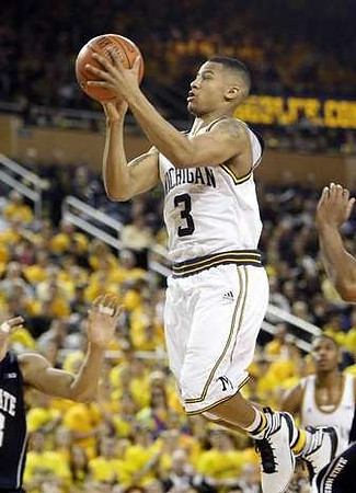 Trey Burke (3) and Glenn Robinson III (1)
