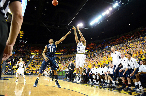 Nik Stauskas (11) and Trey Burke (3)