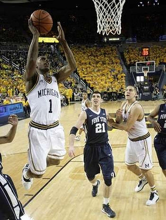 Glenn Robinson III (1), Mitch McGary (4), and Trey Burke (3)