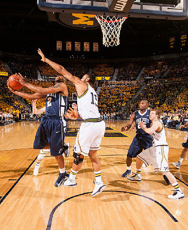 Jon Horford (15) and Spike Albrecht (2)