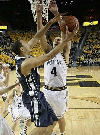 Mitch McGary (4) and Spike Albrecht (2)