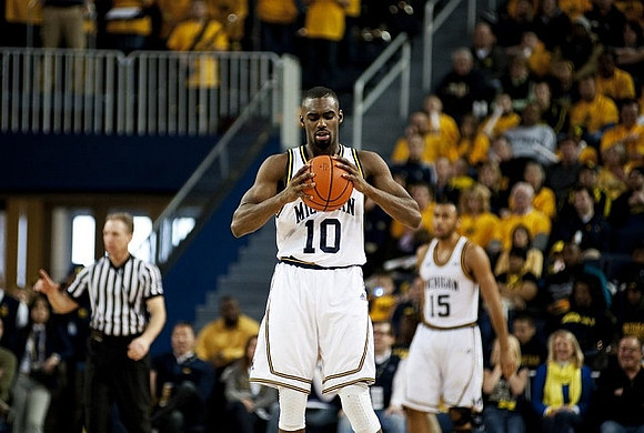 Tim Hardaway Jr. (10) and Jon Horford (15)