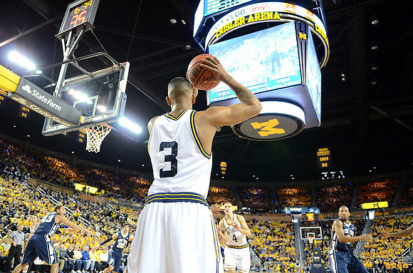 Trey Burke (3) and Mitch McGary (4)