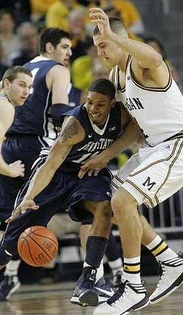 Nik Stauskas (11) and Mitch McGary (4)