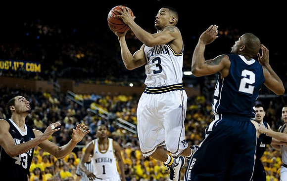 Trey Burke (3) and Glenn Robinson III (1)