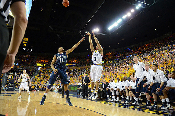 Nik Stauskas (11) and Trey Burke (3)