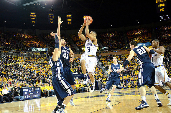 Trey Burke (3) and Glenn Robinson III (1)