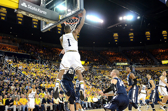 Glenn Robinson III (1), Trey Burke (3), Caris LeVert (23), and Mitch McGary (4)
