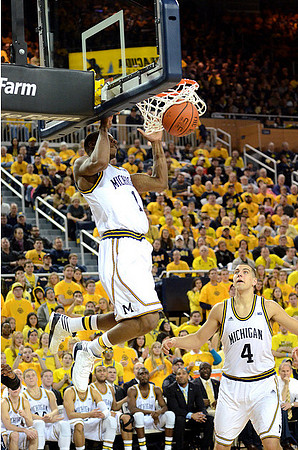Glenn Robinson III (1) and Mitch McGary (4)