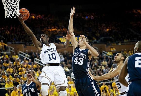 Tim Hardaway Jr. (10) and Jon Horford (15)