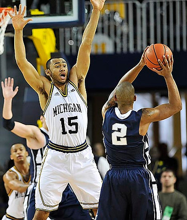 Jon Horford (15) and Trey Burke (3)