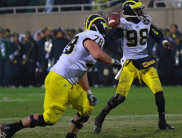 Erik Magnuson (78) and Devin Gardner (98)