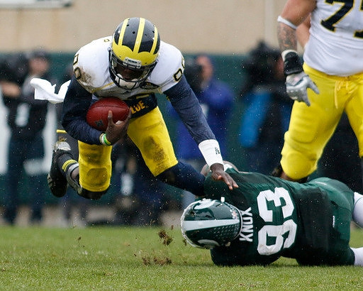 Devin Gardner (98) and Michael Schofield (75)