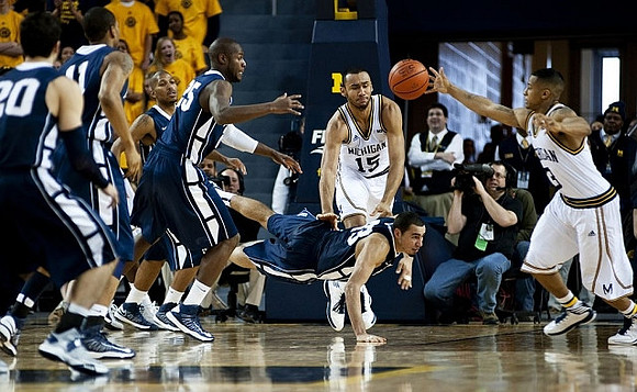 Jon Horford (15) and Trey Burke (3)