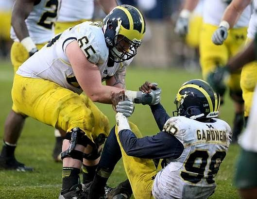 Kyle Bosch (65) and Devin Gardner (98)