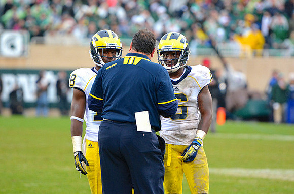 Blake Countess (18), Raymon Taylor (6), and Brady Hoke