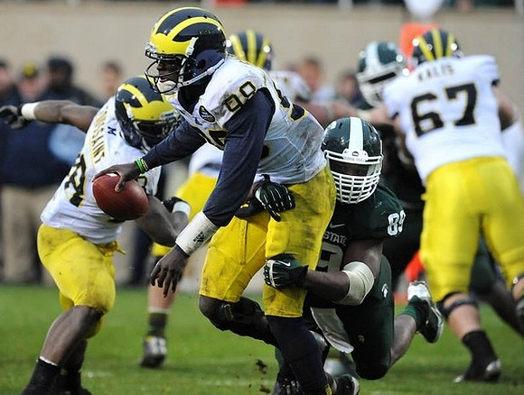 Devin Gardner (98), Fitzgerald Toussaint (28), and Kyle Kalis (67)
