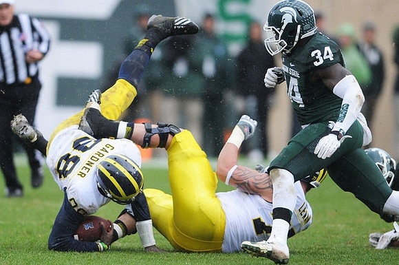 Devin Gardner (98) and Taylor Lewan (77)