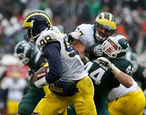 Devin Gardner (98) and Taylor Lewan (77)