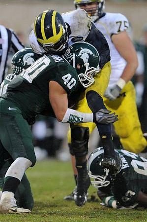 Devin Gardner (98) and Michael Schofield (75)